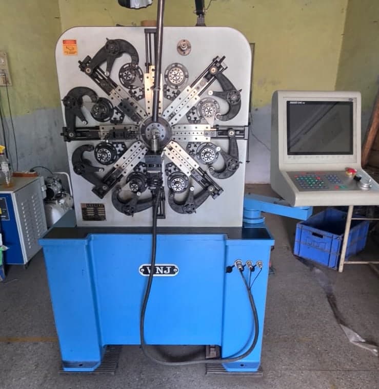 CNC spring coiling machine at the Spring Tech factory in Bhosari